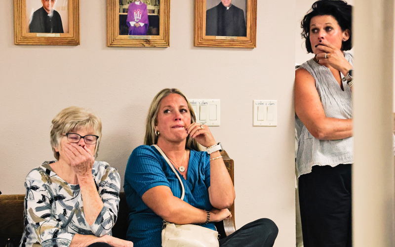 St. Joseph Parish fire committee members Terri Mebius, Hilary Grohs and Becka Havlik react as Diocese of Sioux Falls leaders announce that St. Joseph Catholic Church in Wessington Springs will not be rebuilt following the December fire.