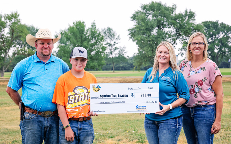 The Spartan Trap League was awarded $700 to help pay for shooting sports equipment. Pictured from left to right: Spartan Trap League Coach AJ Karsky, Spartan Trap League Team Member Parker Karsky, Central Electric Manager of Communications Tara Miller and Operation Round-Up Trustee Amber Kolousek.