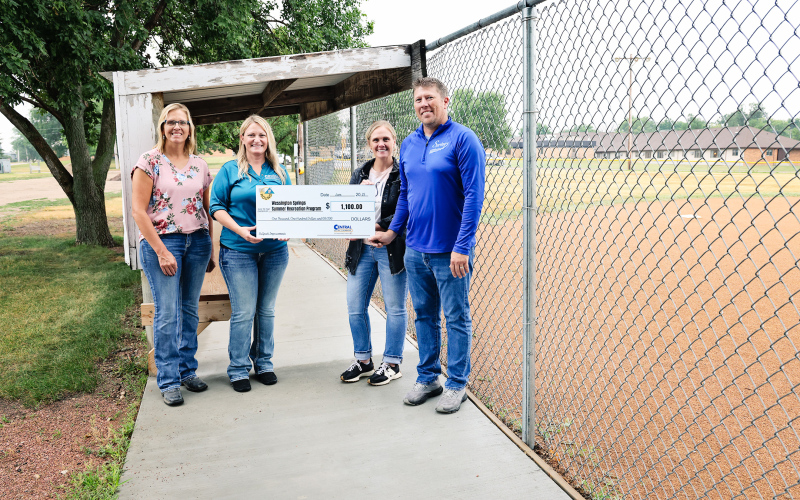 The Wessington Springs Summer Recreation Program was awarded $1,100 to help pay for concrete sidewalks and dugouts. Pictured from left to right: Operation Round-Up Trustee Amber Kolousek, Central Electric Manager of Communications Tara Miller, W.S. Summer Recreation Program Committee Members Natasha Waters and Ryan Jensen.