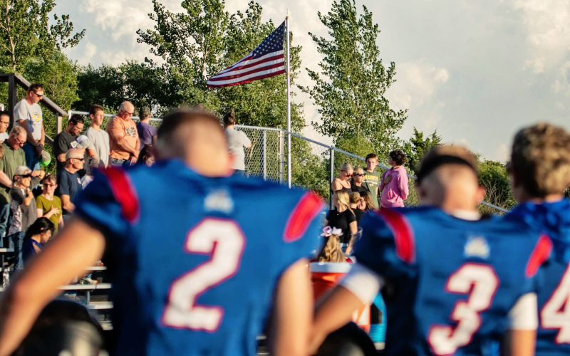 Bucks players line up with the American flag flying beyond the field during their Sept. 11 game against Mobridge-Pollock in Forestburg. A moment of silence was held before the game in remembrance of the victims of the Sept. 11, 2001, terrorist attacks, 25 years after the attacks. (PHOTO COURTESY J. VON EYE IMAGES)