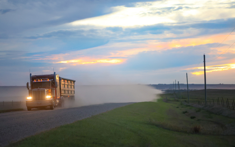A semi hauling grain travels east along 221st Street, a major route for harvest traffic through Jerauld County. (TRUE DAKOTAN FILE PHOTO) LEFT: Newly installed signs mark the new 40 mph speed limit along 221st Street. (PHOTO COURTESY JERAULD COUNTY SHERIFF’S OFFICE)