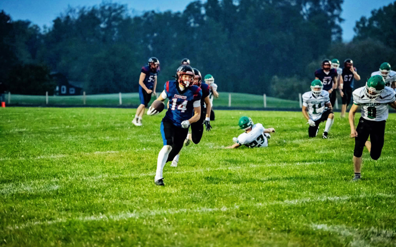 Teagen Eggleston carries the ball for the WWSSC Bucks during Friday night’s rainy homecoming victory. (PHOTO BY J. VON EYE IMAGES)