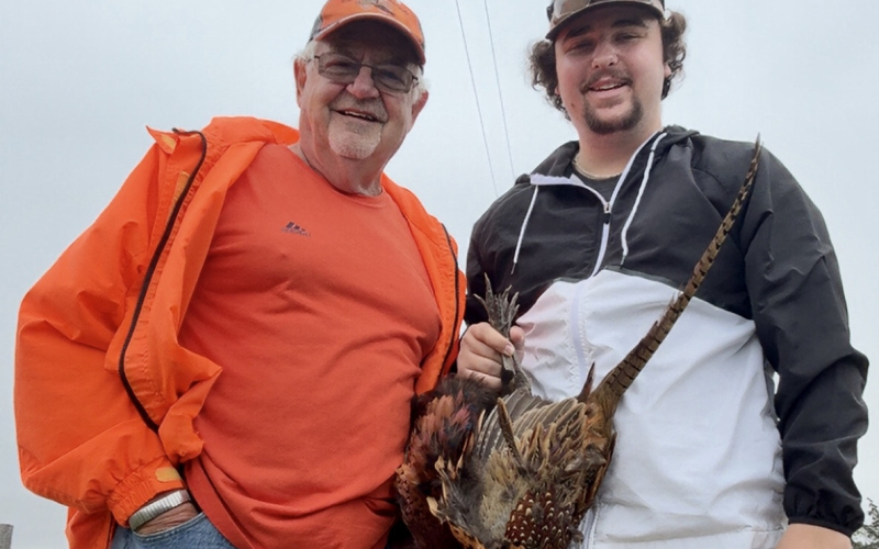 Craig and Layne Wenzel stopped to take a picture during their first grandfather/grandson hunt last year. They both agreed they will do it again this season. PHOTO/CRAIG WENZEL