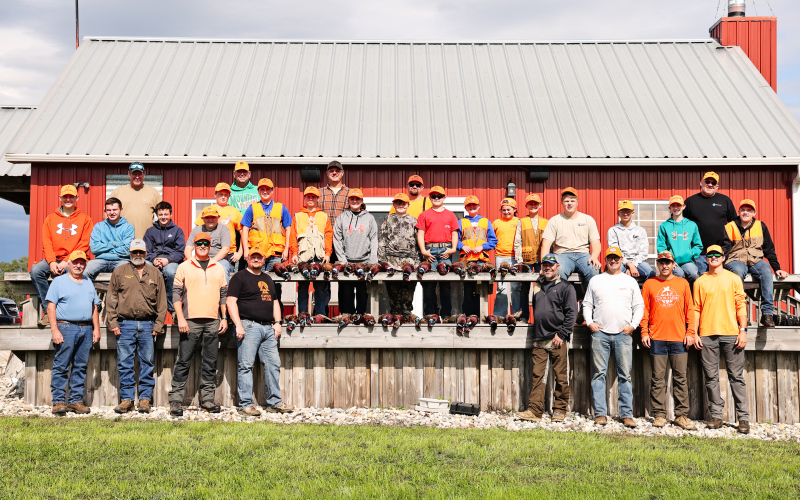 Young hunters gather with their mentors and Wessington Springs Pheasants Forever volunteers during the annual Youth Hunt held Oct. 3, 2026. Jason and Cristin Weber provided the hunting grounds, while the Mullett family provided the facilities pictured in the background. (KRISTI HINE / TRUE DAKOTAN)