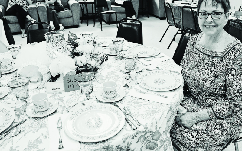 Susan Arnott seated at the table she decorated at the 2022 Festival of Tables. TRUE DAKOTAN FILE PHOTO