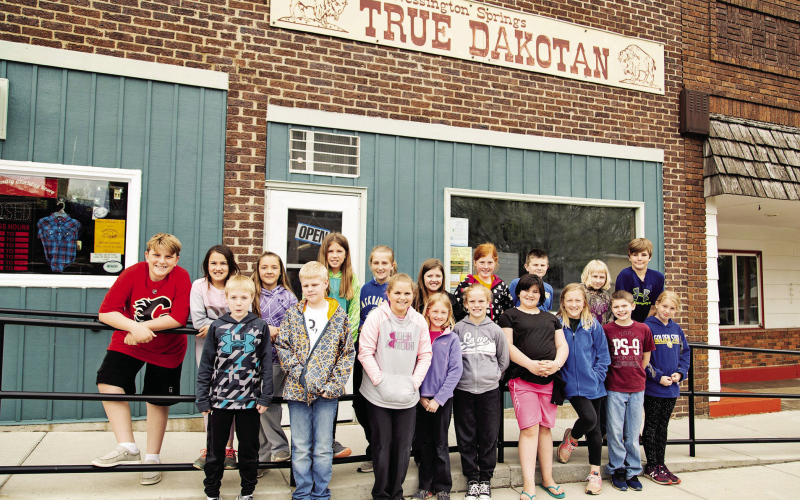 Members of the Wessington Springs Elementary School “WSES News” staff pose outside the True Dakotan office during a 2019 field trip to learn about local news. Several students pictured are now members of the graduating Class of 2026, a reminder of how quickly the years, and stories, have unfolded. (TRUE DAKOTAN FILE PHOTO)