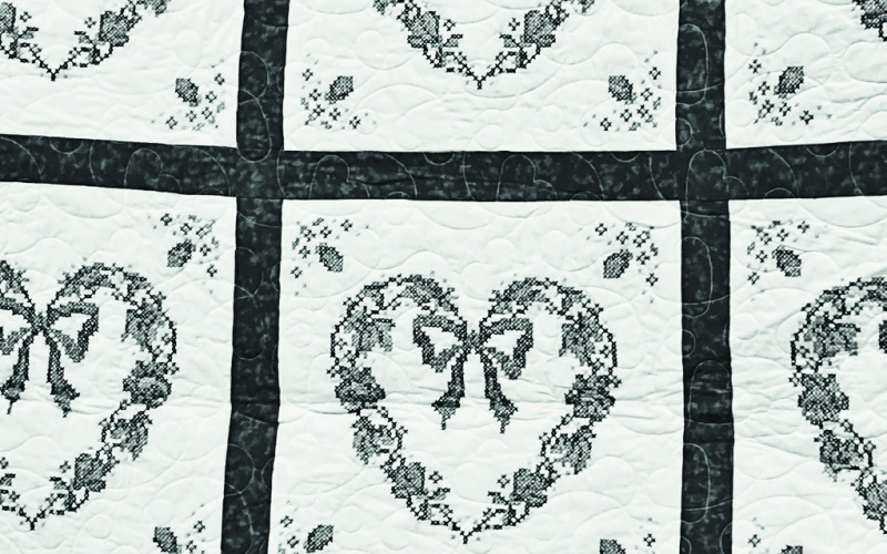 Sharon DiCarlo has donated the blue, pink and green cross stitch embroidered quilt pictured above to a fundraiser for the Wessington Springs Senior / Community Center.