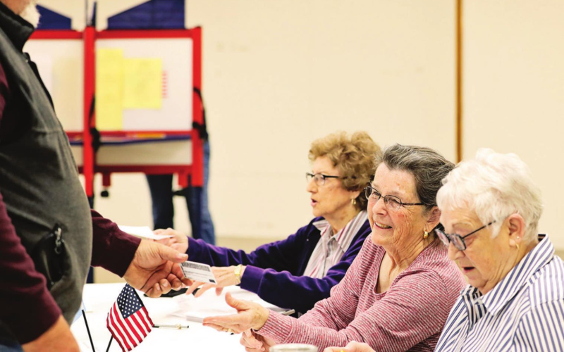 Poll workers were busy right out of the gate during municipal and school board elections Tuesday. Above left, school poll workers Norma Powell, Jean Ferguson and Pam Hainy help registered voter Brian Wetzel. At right, city poll workers Pam Frank, Vicki Harmdierks and Vickie Brodkorb assist Joey Mitchell as he prepares to vote. KRISTI HINE / TRUE DAKOTAN