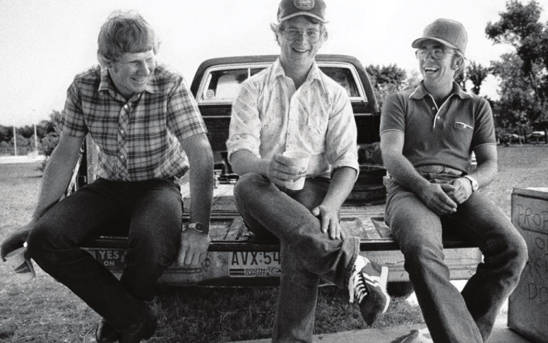 THREE GUYS ON TAILGATE Country wisdom is sometimes best when shared with a round of beer on an open tailgate.