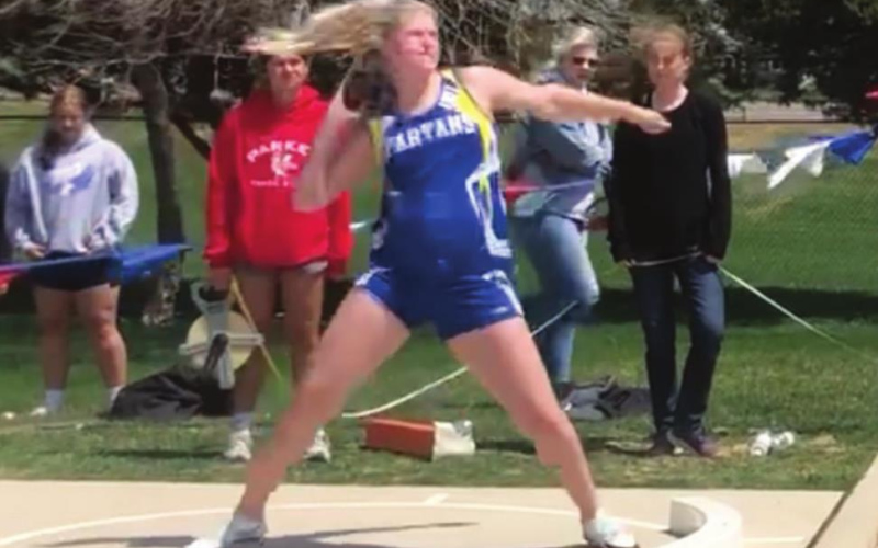 TOP: Karter Mebius, Carter Grohs, Alyssa Grohs and Logan Mohling were the first Spartans ever to run a mile relay coed squad qualify. The new school record holders passed the baton around in 4:07.97. ABOVE: Avery Orth won the shot-put competition at the Parker Invitational with her distance of 37’ 1. PHOTOS COURTESY BECKY KRUEGER