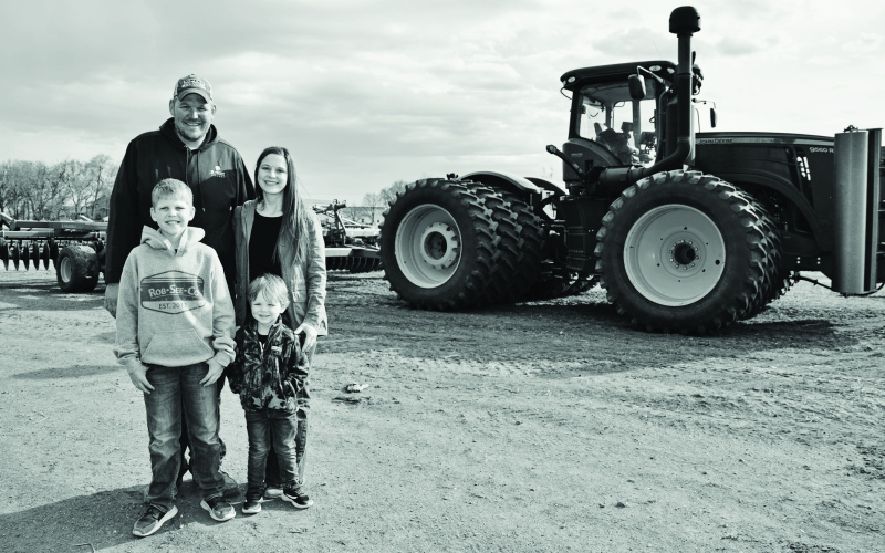 The Albrechts farm near Alpena, Chris and Amy with their sons, Cade and Cale. PHOTO COURTESY SDFU