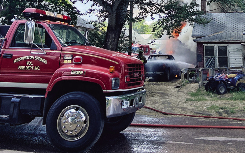 When firefighters arrived on scene, they found the garage, southwest side of the house and pickup truck engulfed in flames.