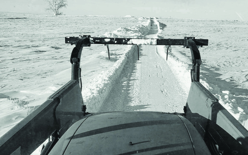 The long road to spring, or the driveway at least, appears awfully challenging for area producers like Tyler and Cam Fagerhaug. A job well done clearing will likely be blown back in mid-week. PHOTO BY TYLER FAGERHAUG