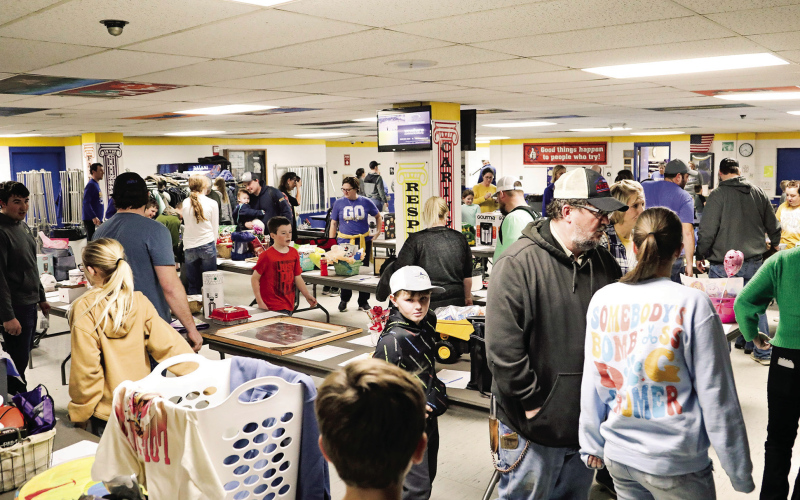 Hundreds of people filtered through the Wessington Springs Elementary cafeteria for a fundraising event for the Carothers family last Tuesday. Twelve-year-old Reba Carothers died Monday, February 5, days after she was struck by a car while trying to board a school bus on Jan. 26. The fundraiser, which involved a dinner, a silent auction and a 50-50 raffle, began before the Wessington Springs, Wolsey-Wessington varsity basketball game that took place in the adjacent gym. PHOTO BY KRISTI HINE / TRUE DAKOTAN