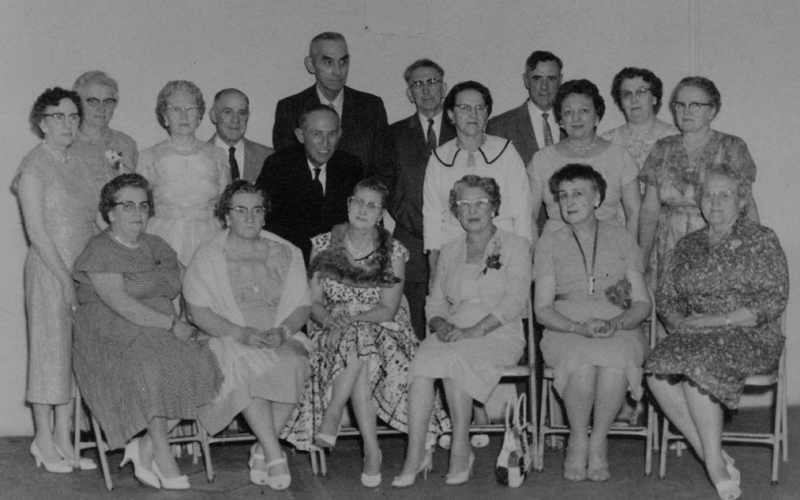 Back row, left to right: Marie (Sutton) Bromwell, Blanche (Easton) Hodgson, Zella (Hackett) Brakke, Howard Hart, Darwin McDonald (in front of Maurice Zink), Maurice Zink, Harold Piper, Aleta (Vessey) Guindon, Roy Gaffin, Beulah (Zink) Stockstad, Elsie May Gaffin (Wife of Roy Gaffin), Effie (McVey) Schaefer. Front row, left to right: Hattie Richards, Lilas (Hyde) Nelson, Hazel (Sorensen) Wood, Ethel Marie (Zink) Ross, Sylvia (Zink) Wheelock, Meta (Lawson) Carson.