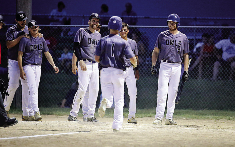 PHOTO COURTESY RODNEY HAAS/605 SPORTS Wessington Springs Owls celebrate as Blake Larson crosses home plate. Larson added a solo home run as part of a two-hit day during a district battle vs. Burke.