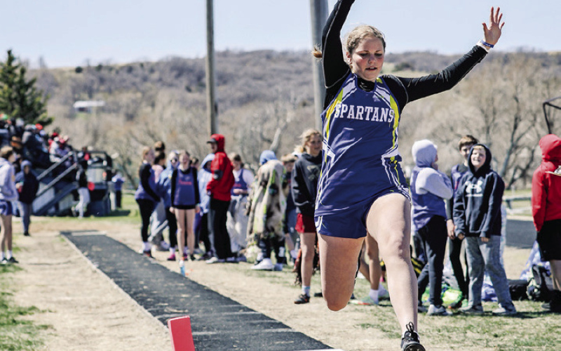 The junior high / JV Spartans hosted the 281 track and field conference meet Monday. Kaitlyn Braun is shown mid- long jump at Spartan Field. More sports news can be found in this week’s print and e-edition on PAGES TWO AND THREE