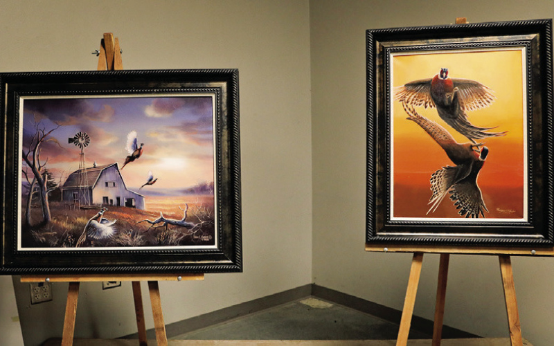 Original artwork by local artist Kenzee Schafer and Madison- based, 1991 South Dakota State Artist of the Year, John Green brought a pretty penny to the chapters coffers during the live auction.