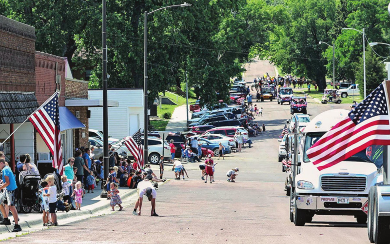 Kids scrambled for candy and other goodies showered on the crowd by parade float occupants.