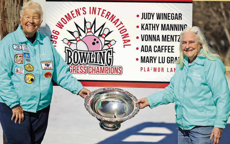 Judy Winegar (left) and Vonna Mentzer are pictured in front of the Wessington Springs Honor sign at the entrance to town. Earlier this year, a plaque commemorating the 1986 Wessington Springs Ladies Bowling team and their Women’s International Bowling Congress Championship title was hung as the newest addition to the honor sign. The two hold the “punch bowl” trophy they won in 1986. Photos of the entire team in 1986 can be found online at www.truedakotan.com. KRISTI HINE / TRUE DAKOTAN