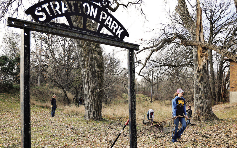 FFA students haul debris from the storm-damage at Stratton Park during a Nov. 15 cleanup effort.