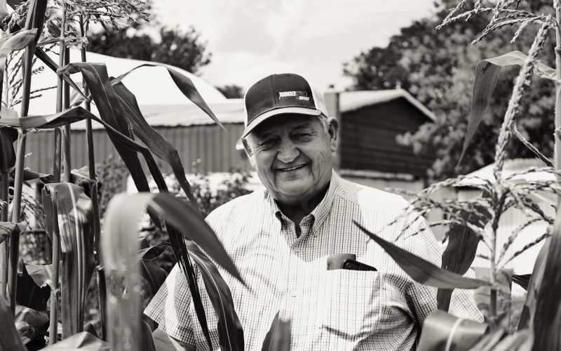 Ron Neugebauer stands in a patch of sweet corn in his garden west of Dimock, S.D. (Photo: Abbey Stegenga / SD News Watch)