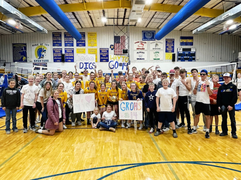 Fellow players, fans and family members joined Alyssa Grohs for a celebratory photo to commemorate reaching the 1000-dig milestone last Tuesday on October 25. Grohs reached the milestone during a home victory against Hitchcock-Tulare.