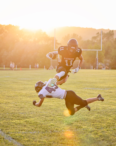 Ryder Michalek (11) evades a tackle in a show of athleticism during Friday’s Blackhawks game vs. the Mt. Vernon / Plankinton Titans. The Blackhawks came out on top in the 2023 season’s first game with a 36-8 victory.