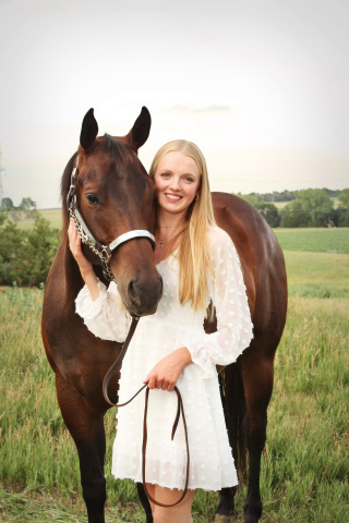 Abby Kolousek, a WSHS senior who is hosting a playday next weekend as part of her senior project, is shown with her horse Diesel. A frequent participant in horse competitions, her favorite event is hunter equitation over fences.