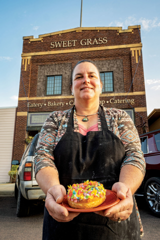 Heather Larson, owner of Sweet Grass in Wessington Springs, offers a special donut covered in Fruity Pebbles cereal.