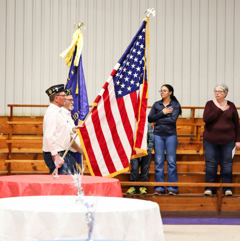 Gary Orth (foreground) and Dick Small retire the colors during the Alpena Memorial Day program held at the Owen Kunze American Legion Post 116. 
