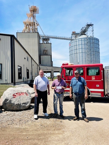 Alpena Fire Department’s Fire Chief, Ryder Schweitzer, (center) received the $3000 raised at the 12th Annual Brett Boomer Memorial Golf Classic. He is shown with Volunteer Fireman Chris Albrecht, (right) and Todd Boomer, (left). Proceeds from the event are used to help improve the AFD’s firefighting/rescue equipment and for continued training.  