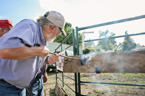 Tom Dean of Wessington Springs branded a board at the branding party held in June. TRUE DAKOTAN FILE PHOTO