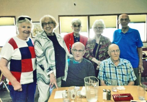 Pictured from left to right standing: Deloris Grohs Fuegen, Maureen (Mickey) Rhodes Hein, Vera Speck Weber, Kathleen Wall Balster, Dayle Winter. Seated: Don Grohs and Lloyd Kraft.