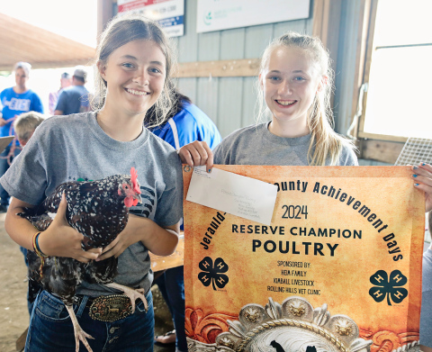 Kaycee Scheel and Tenley Olinger pose for a photo during Achievement Days 