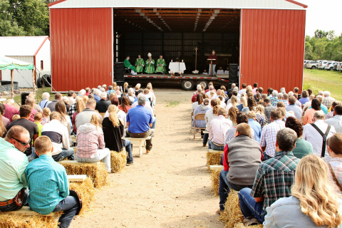 PHOTO COURTESY ALICIA ROESLER. Over 250 people from across the region and various faith backgrounds gathered for mass, a free meal and a speaker on the topic of “Faith and Farming” earlier this month. The event was held at Kolousek Farms  located southwest of Wessington Springs.