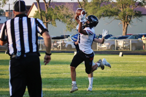 Wessington Springs/ Woonsocket/Sanborn Central's Sam Poncelow (4) leaps to make a catch, scoring a touchdown for the Blackhawks during a Class 11B football game on Friday, Aug. 23, 2024, in Bridgewater. PHOTO: Blake Durham / Mitchell Republic
