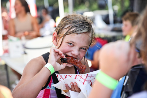 Carlayna Waters cooled off in the pool then returned to the park to sample the wide variety of ribs prepared by 13 different contestants. 