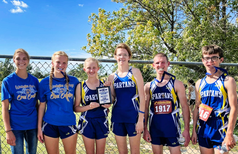Girls Varsity brought home the first-ever team championship plaque in the MVP Cross Country Invitational last Wednesday. Shown left to right are members of the Spartans Cross Country team: Bailey Yost, Ella Kolousek, Alexis Roesler, Masynn Mebius, Sam Welsch and Ranick Fjerstad. PHOTO COURTESY BECKY KRUEGER