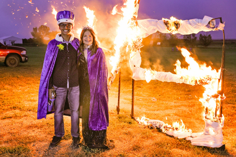 Homecoming King Richard Cardona and Queen Kennedy Kolousek at the “burning of the WS” at coronation.