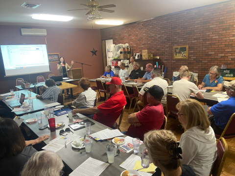 KRISTI HINE / TRUE DAKOTAN The Springs Inn meeting room was filled with voters and landowners eager to learn more about Referred Law 21 earlier this month on Wednesday, September 11. The meeting featured Representative Karla Lems of District 16 (speaking) and Chairman of the South Dakota Property Rights and Local Control Alliance (SDPRLCA), Jim Eschenbaum, who is also a Hand County Commissioner.