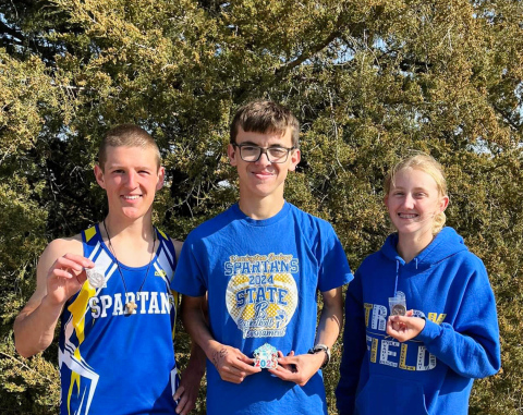(PHOTO COURTESY BECKY KRUEGER) Three Wessington Springs High School student athletes finished in the top 20 at the Region 4B meet in Gettysburg, qualifying the trio to advance to state. Shown left to right are Sam Welsch, Ranick Fjerstad and Alexis Roesler. Read coach’s commentary inside this week’s print and e-edition on PAGE TWO