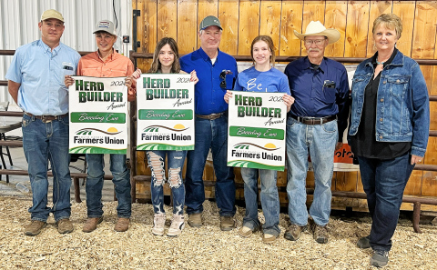 (PHOTO COURTESY SDFU) Rylan Fagerhaug of Wessington Springs, Brooke Lamont of Union Center and Evelyn Bunker of Reliance won breeding ewes through the South Dakota Farmers Union Herd Builder Award presented during the Western Jr. Livestock Show in Rapid City. The Herd Builder winners are pictured here with Rocky Forman, SDFU Member Services Coordinator, David Reis, SDFU Board Member, Dallis Basel, SDFU Board Member and Karla Hofhenke, SDFU Executive Director.