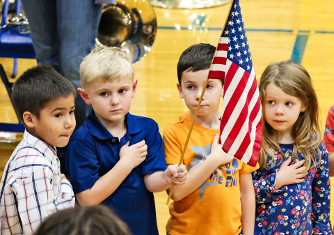 Pre-K students Kooper Argo, Eastyn Waters, Kase Van Dyke, Zoe Duxbury helped lead the crowd in the Pledge of Allegiance. 