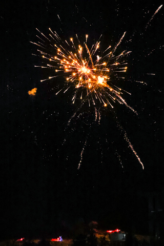 An orange rocket illuminated the New Year’s Eve sky over South Gulch in Wessington Springs last Wednesday night, December 31, 2024 as Jarrod and Jacki Bultsma, Jason and Cristin Weber and Dennis and Sandy Beckman carried on the tradition of gifting a glorious fireworks display to the community. KRISTI HINE / TRUE DAKOTAN 