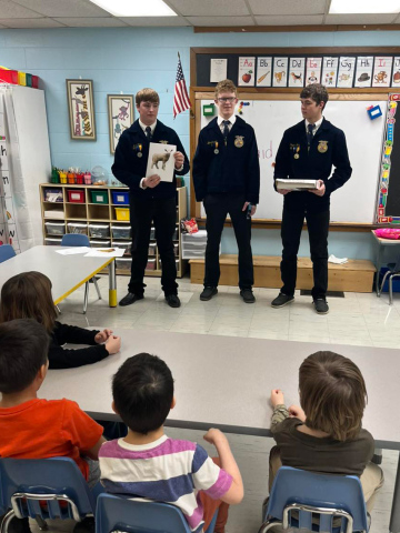 Max Klein, Luke Larson and Peyton Walz taight elementary school students during “Ag in the Classroom” last week. PHOTO COURTESY WS FFA CHAPTER
