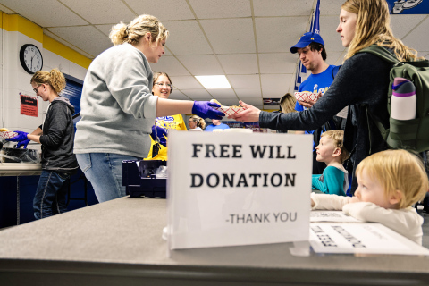 Wessington Springs Elementary School teachers Sarah Larson, Kacee Polly, Becky Krueger and Kim Orth are seen serving the free will donation meal at the benefit to event attendees Drew, Catherine, Asher and Emery Kraft.