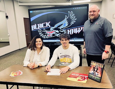 Shown left to right during a letter of intent signing with Northern State University are Becka Havlik, Holden Havlik and Head Blackhawks Coach Michael Schmitz. Holden Havlik signed to play quarterback at Northern State University. PHOTO COURTESY BECKA HAVLIK