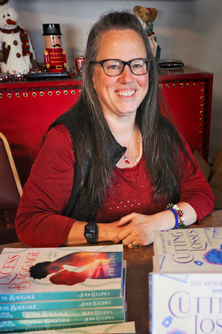 Hometown author Jodi Culliney, daughter of Joe and JoAnn Hettinger and a Class of 1991 Wessington Springs High School alumni is shown above at Springs Inn Cafe over the winter during a book signing. Her first novel in the book series “Love, South Dakota Style” has been chosen as the SACOTA Spring Book Club selection. KRISTI HINE / TRUE DAKOTAN