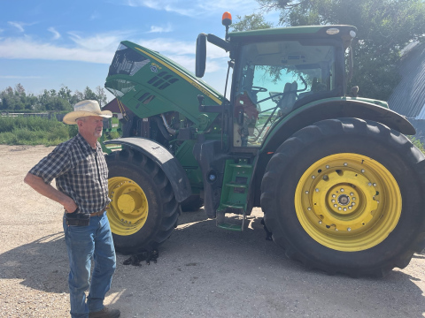 Don Zilverberg, a third-generation cattle rancher in Hyde County, S.D., returns from working the fields to bale alfalfa on July 24, 2023 in Holabird, about 40 miles east of Pierre. (Photo: Stu Whitney / South Dakota News Watch)